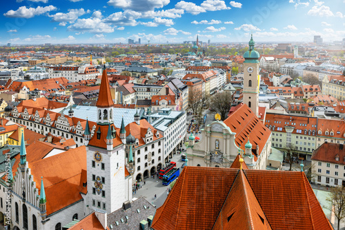 Elevated view of the skyline of Munich, Germany, with the old townhall and Heilig Geist church during a sunny day