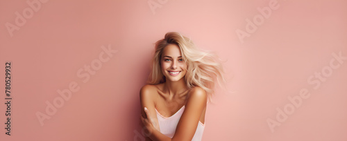 portrait of a blonde beautiful woman on a pink background abstract 
