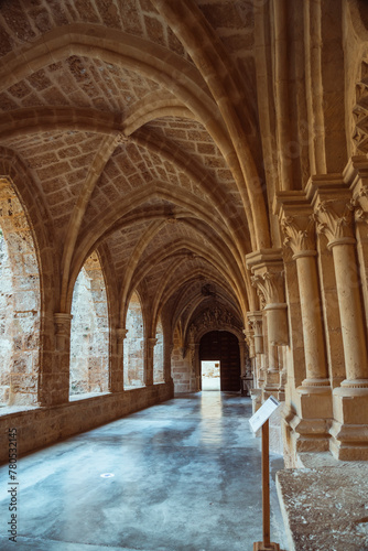 Serene Stone Archways of an Ancient Monastery Corridor