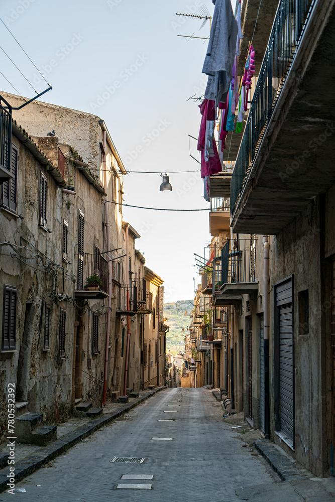 Pietraperzia, Sicily, Italy. Historical city center. Narrow street with houses. Summer sunny day