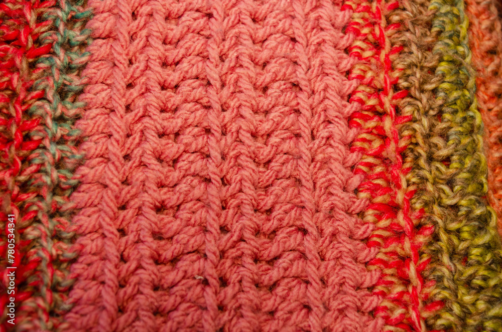 Close-up of a multi-coloured hand knit crocheted blanket