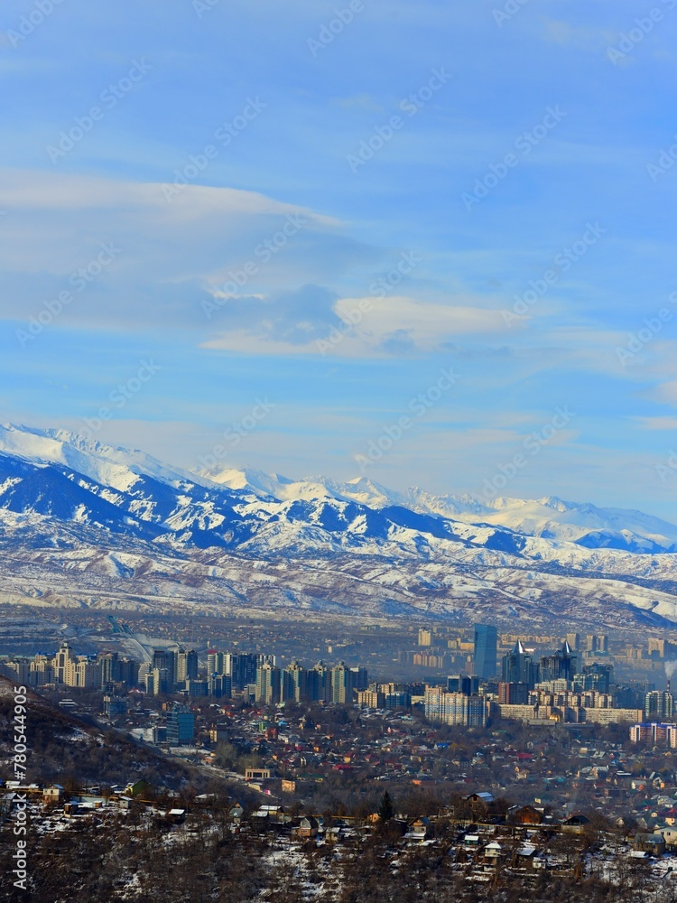 The winter view of the Almaty city panorama and  mountains taken from the surrounding hills