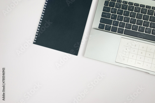 laptop and notepad with copy space.