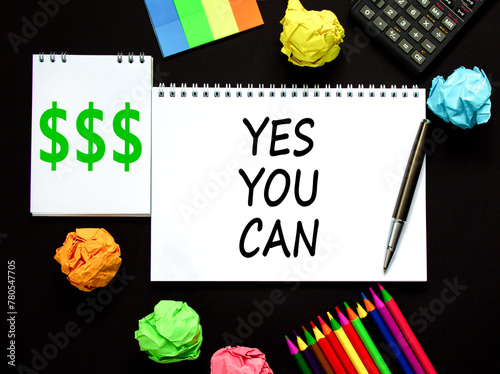 Motivational Yes you can symbol. Concept words Yes you can on beautiful white note. Beautiful black background. Black pen. Calculator. Business motivational and Yes you can concept. Copy space