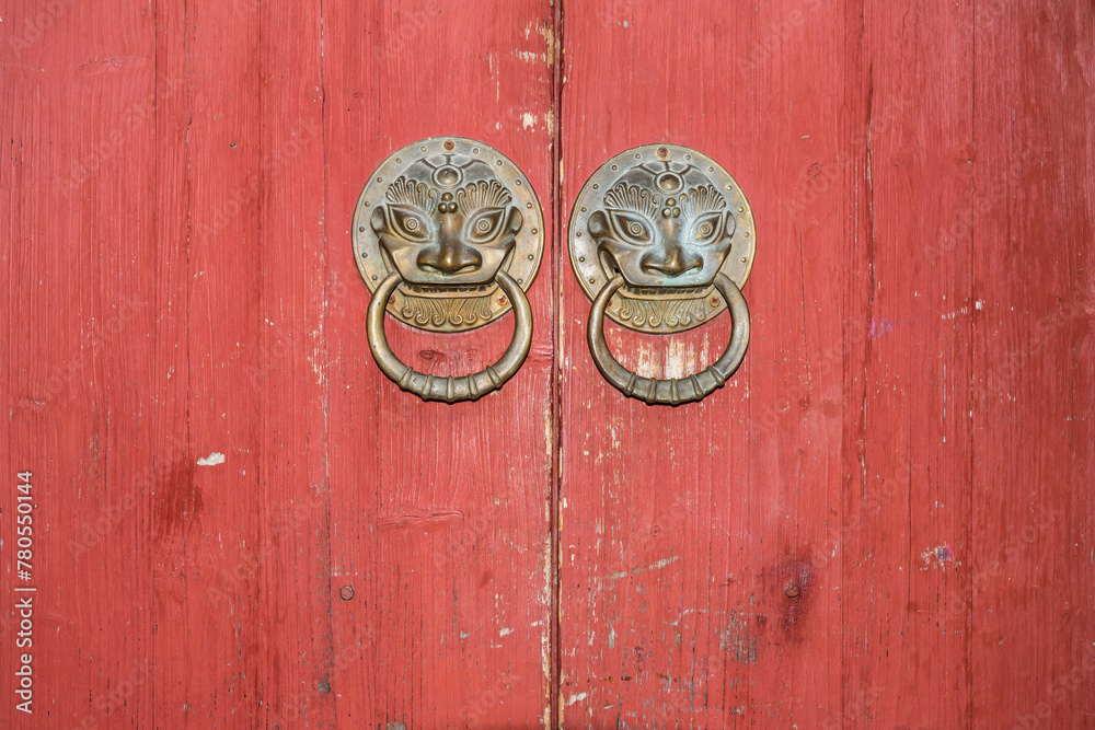 A Chinese antique wooden door and the door knocker A Chinese antique wooden door and the door knocker