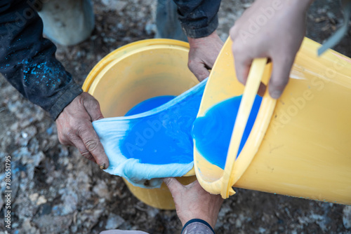Photos Preparation of Bordeaux mixture for seasonal treatment of trees in the garden by spraying for fertilization and protection against insects