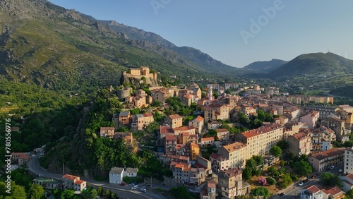 Aerial view of Corte old town, Corsica island. Morning shot of old houses on the hill in Corte village, Corsica, France