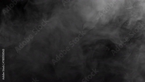 Thick smoke on a black background. Gray fog. Smoke photo