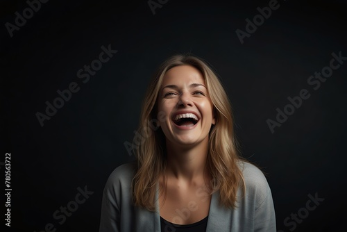 young deutsch middle aged woman on plain bright black background laughing hysterically looking at camera background banner template ad marketing concept from Generative AI