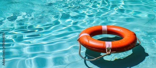 Poolside life preserver in summertime, colored orange.