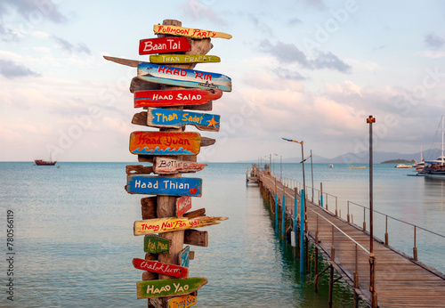 Wooden signposts on Lamai Beach on Koh Samui in Thailand