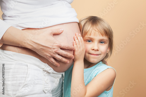 Curious Little Girl Waiting to Feel Her Unborn Sibling Kick