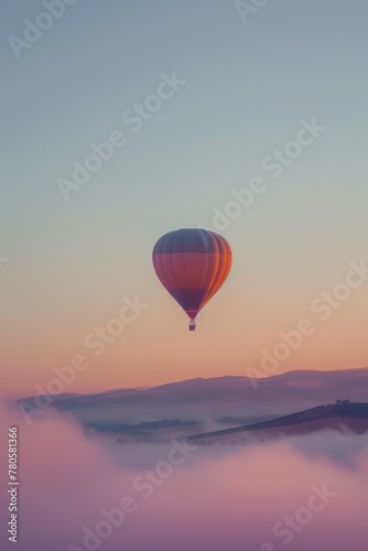 Serene Hot Air Balloon Flight Over Misty Sunrise Landscape