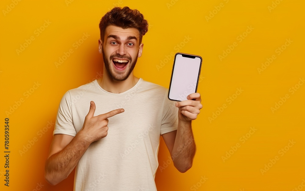 front view of a happy man holding a big smartphone with a white screen pointing at it isolated on a yellow background, mockup, flat lay, stock photo, shot in the style of oriental minimalism.