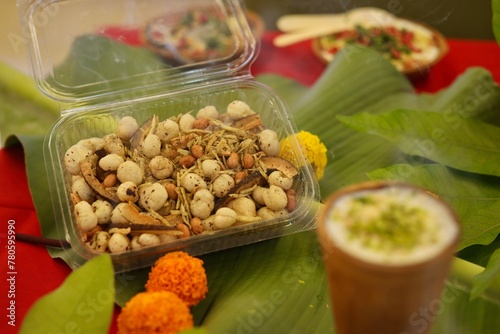 Navratri Upwas Thali / Fasting food platter on banana leaf background photo