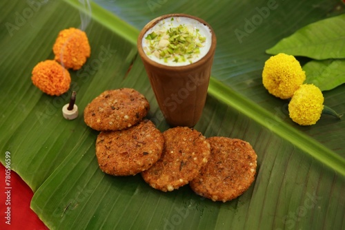 Navratri Upwas Thali / Fasting food platter on banana leaf background