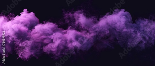 Swirling motions of violet smoke against deep black conjure an abstract landscape of mystery and elegance. photo