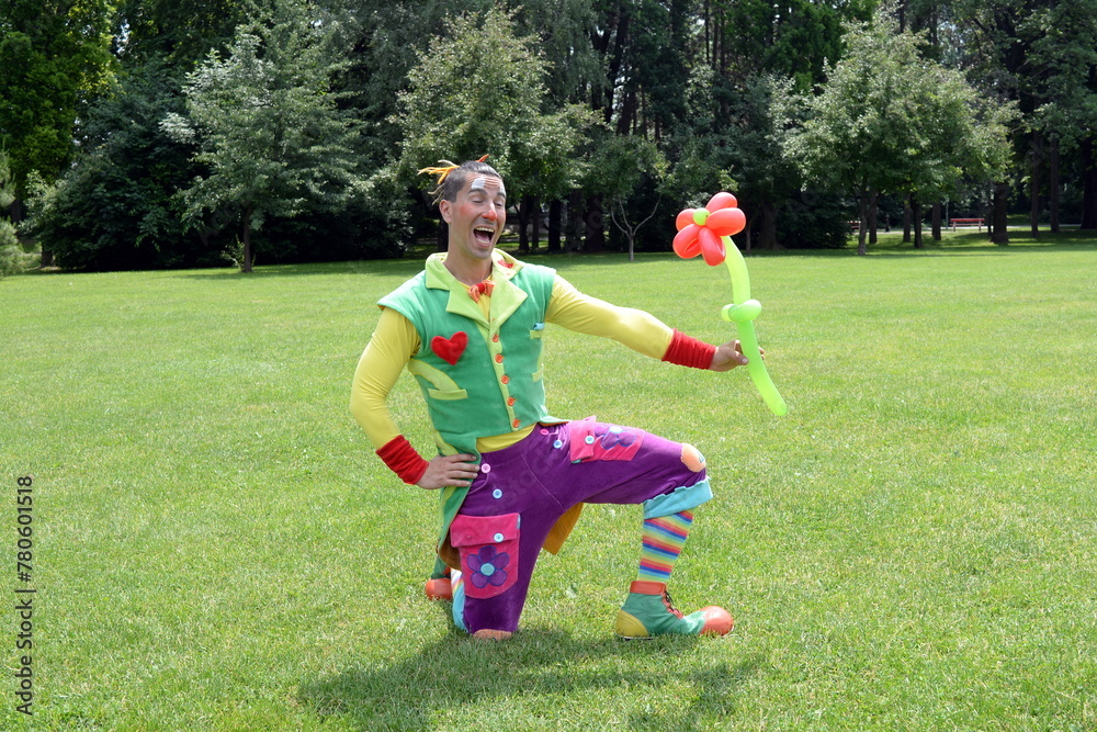 Fototapeta premium Circus juggler portrait. Clown juggling with objects.