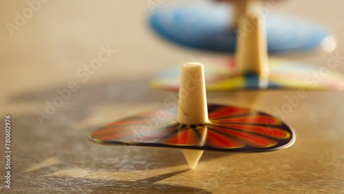Several whirligigs spin around her own axis on the table. photo
