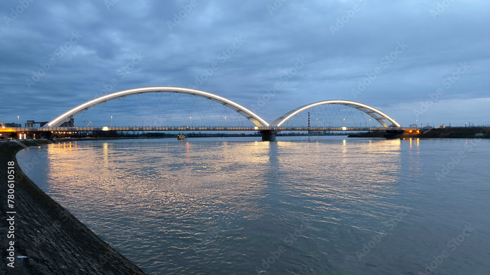 panoramic view of the bridge over Danube river in Novi sad, reflected in the water surface panoramic view of the bridge over Danube river in Novi sad, reflected in the water surface
