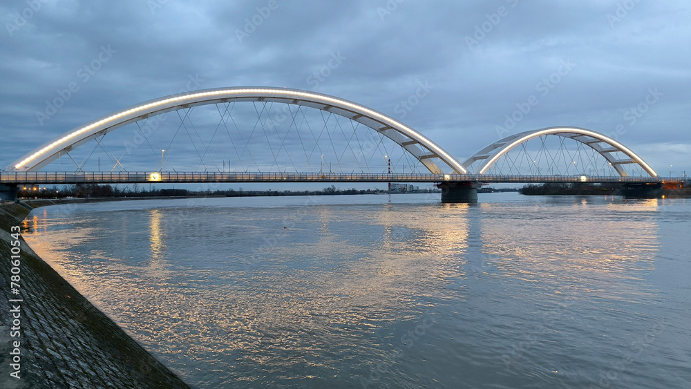 panoramic view of the bridge over Danube river in Novi sad, reflected in the water surface panoramic view of the bridge over Danube river in Novi sad, reflected in the water surface