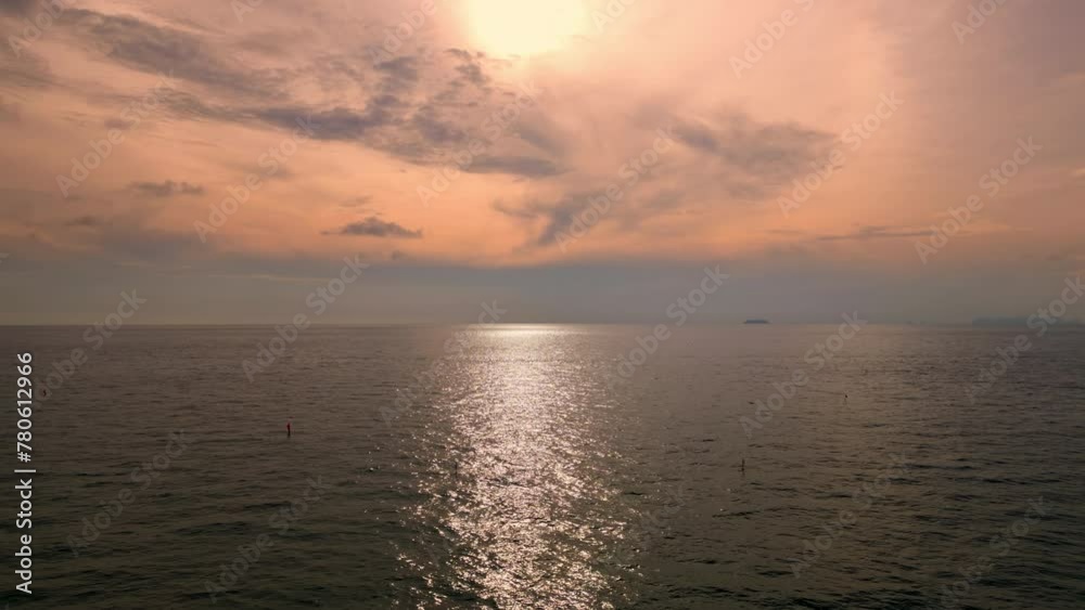 Flying over the ocean at sunset. Aerial view of drone flight over sea in sunset. Flying over the ocean at sunset. Aerial view of drone flight over sea in sunset.