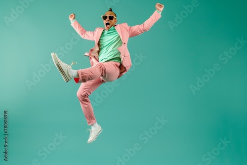 Energetic Man in Pink Suit Jumping © nik_yurginson
