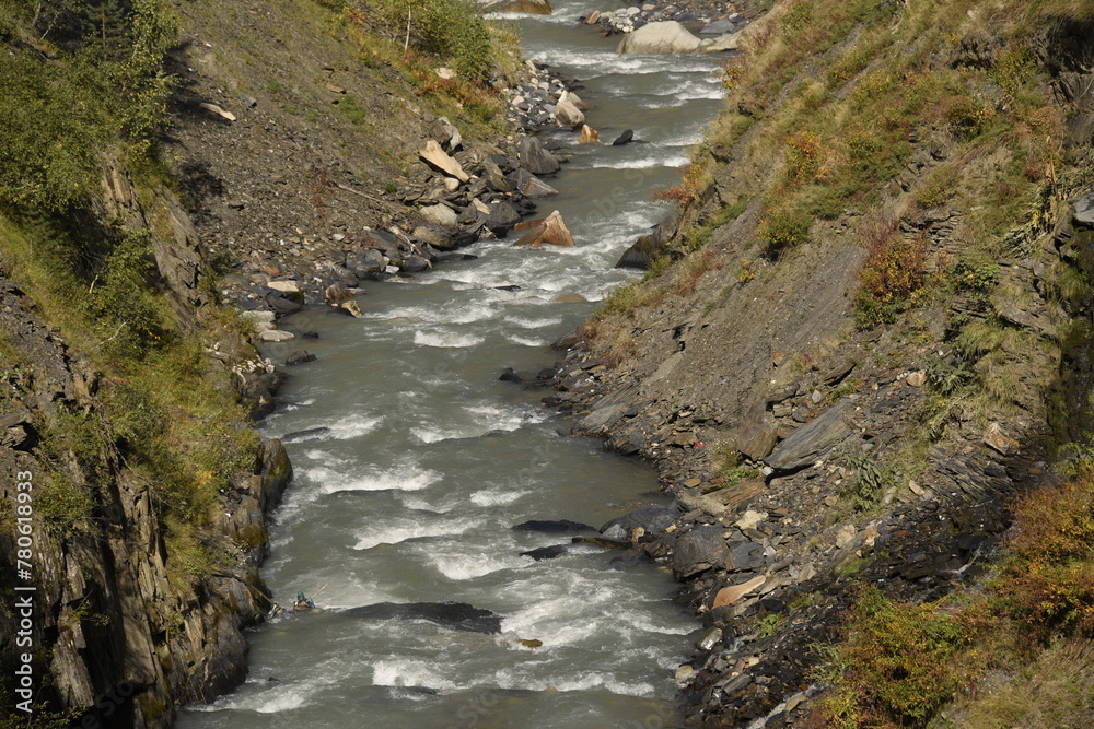 Mountain creek from melting glacier in Ushguli, Svaneti, Georgia Mountain creek from melting glacier in Ushguli, Svaneti, Georgia