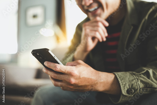 man using cell phone holding mobile texting message contact us.chatting,search internet shopping online.technology device communication connecting © panitan