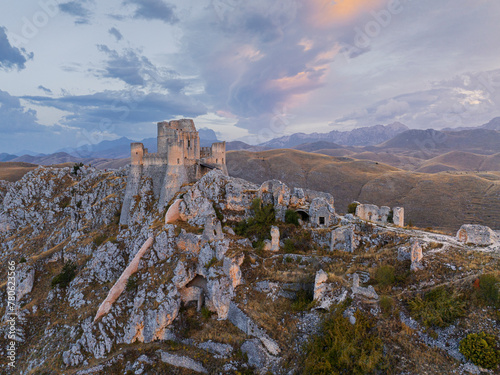 Aerial view taken by drone of Rocca Calascio castle during an autumn sunrise, National Park of Gran Sasso and Monti of Laga, Abruzzo, Italy photo