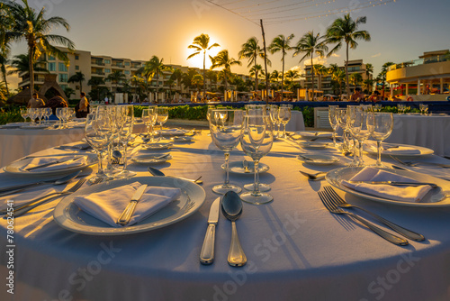 View of set wedding reception table and hotel near Puerto Morelos, Caribbean Coast, Yucatan Peninsula, Mexico photo