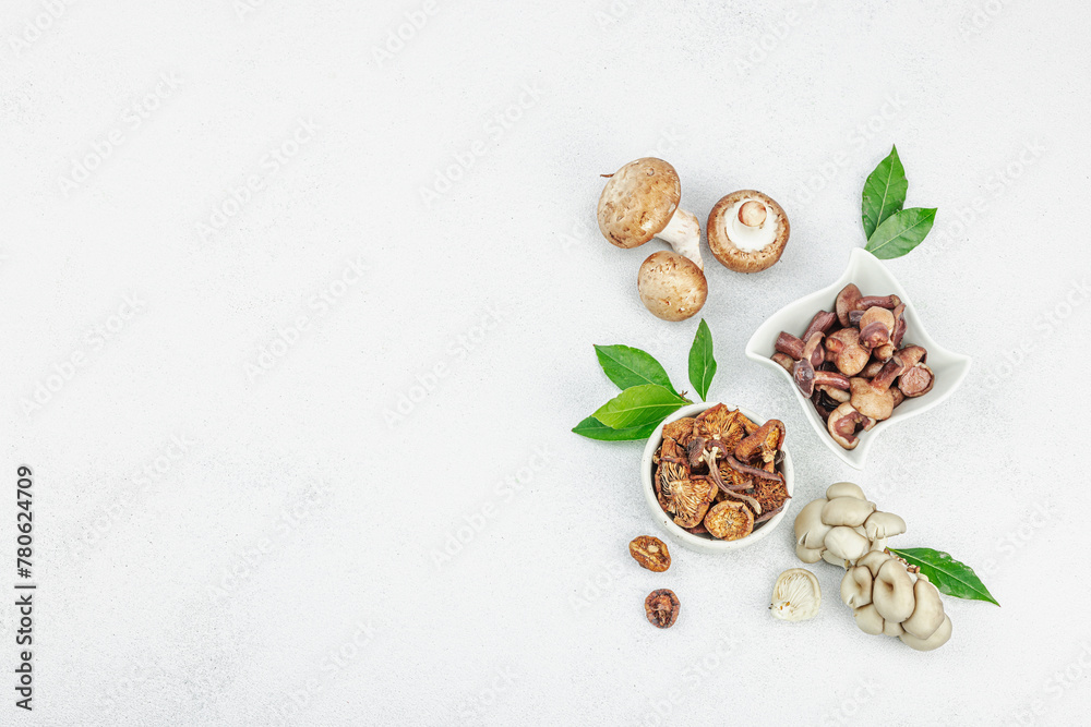 Assortment of various mushrooms - fresh, dried and pickled. Oyster, cremini, porcini and shiitake Assortment of various mushrooms - fresh, dried and pickled. Oyster, cremini, porcini and shiitake