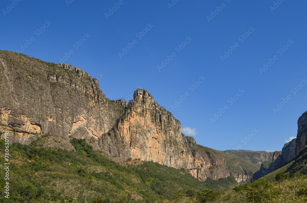 Huge canyon formed by very high vertical walls, inside it runs a river that forms some waterfalls. It is located in Serra do Cipó, Brazil	