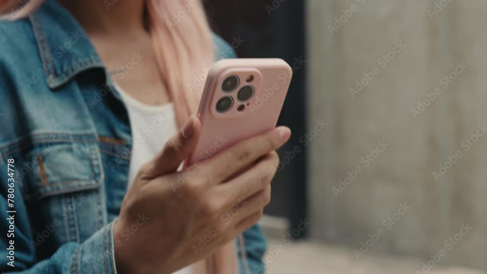 Close Up View of the Man Holding the Smartphone While Walking on the Street and Watching a Video. Close Up View of the Man Holding the Smartphone While Walking on the Street and Watching a Video.