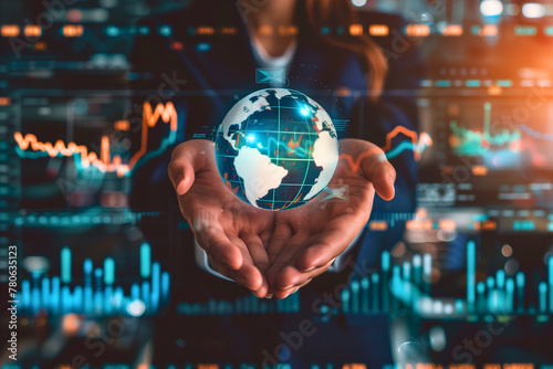 Close-up of a businesswoman's hands holding a glowing globe, symbolizing global business strategies and sustainability, with charts and graphs projected in the background © nut
