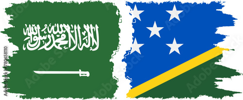 Solomon Islands and Saudi Arabia grunge flags connection vector