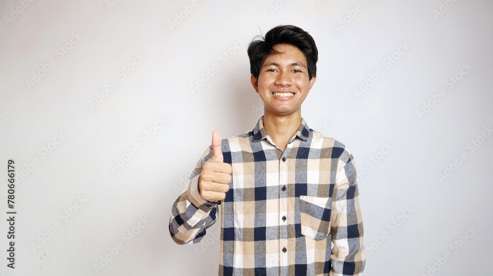 happy young Asian man posing okay or saying cool, cool, good happy young Asian man posing okay or saying cool, cool, good