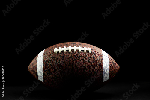 brown leather football on isolated on black background