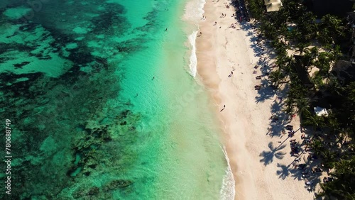 Beautiful sandy beaches in sunny Tulum in Mexico and clear blue water of the Caribbean sea close to Cancun and Playa del Carmen, a perfect vacation destination - Aerial shot drone fly by 