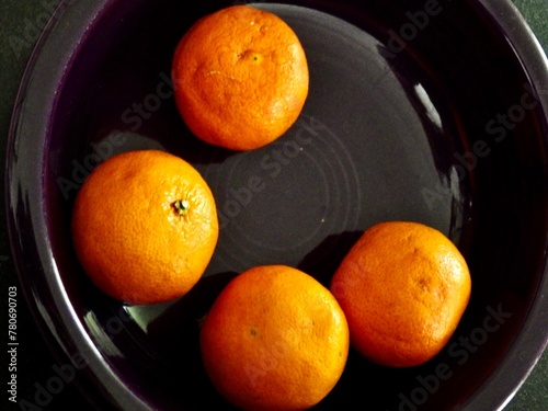 Four Oranges in a Purple Platter
