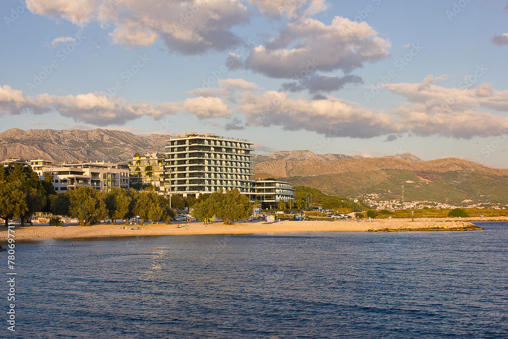 Fototapeta premium Landscape with beach and sea. Blue cloudy sky and blue sea.