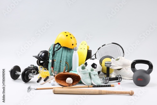 Many different sports equipment on light grey background © New Africa