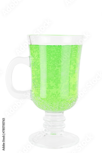 green carbonated drink with bubbles on the walls of a glass mug
