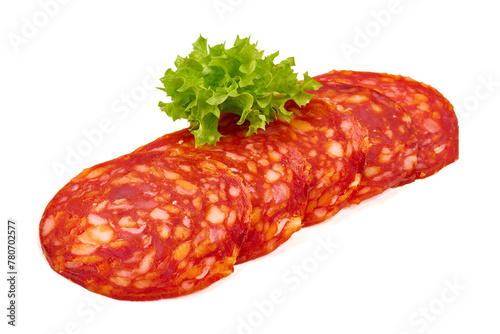 Spanish pork chorizo sausage slices, close-up, isolated on white background