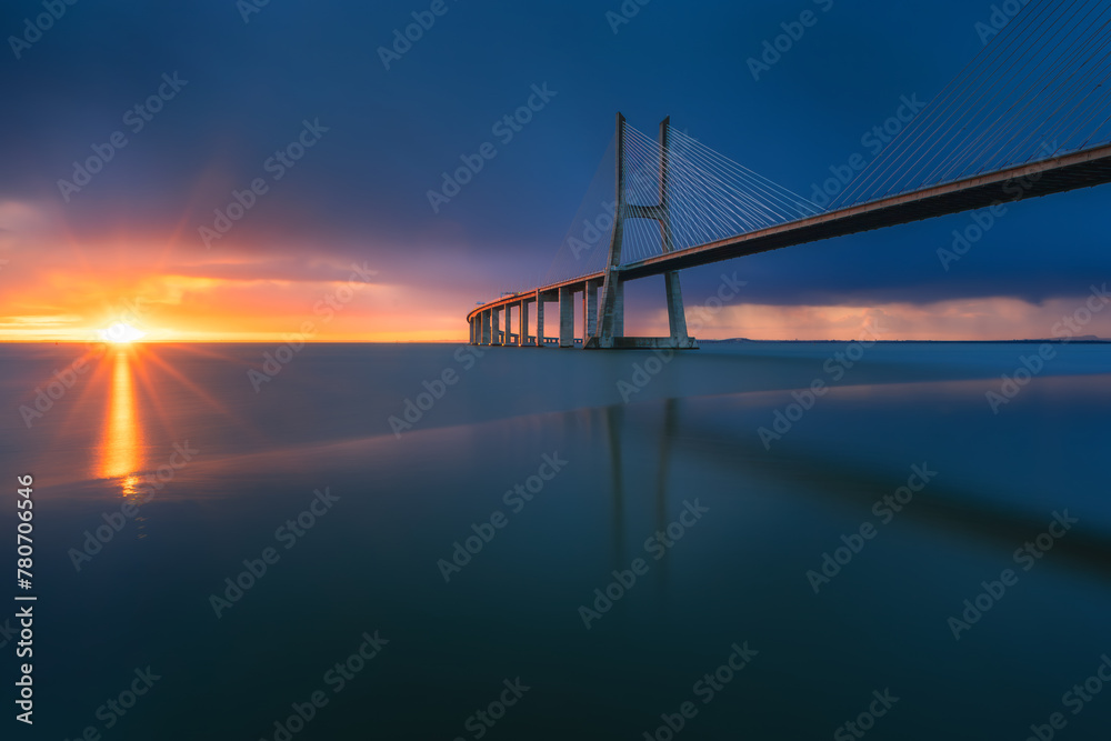 Beautiful sunrise at Vasco Da Gama Bridge in Lisbon, Portugal.