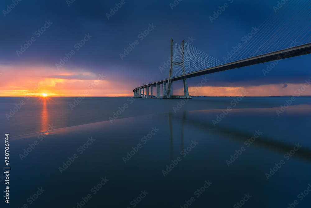 Beautiful sunrise at Vasco Da Gama Bridge in Lisbon, Portugal.