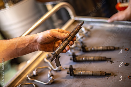 Mechanic Holding Diesel Engine Injector