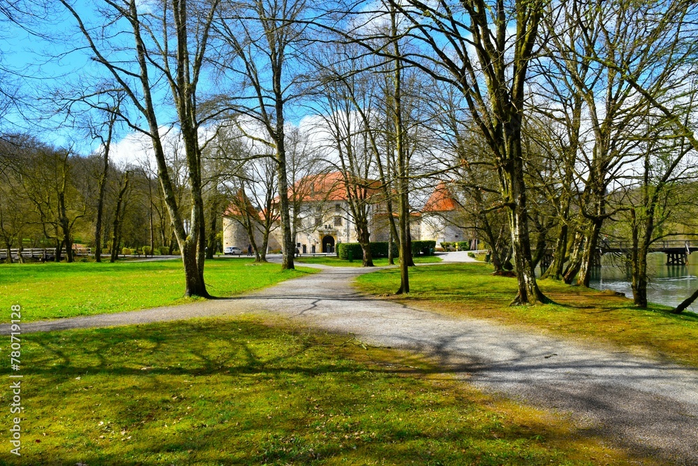 Trail leading through a park in front of Otečec castle in Dolenjska, Slovenia