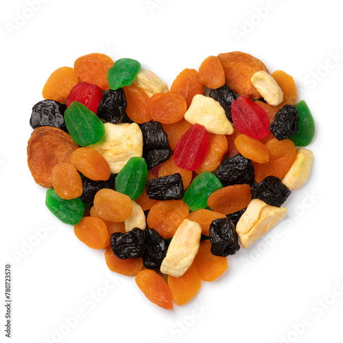Dried fruit, tutti frutti, in heart shape isolated on white background close up