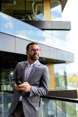 Confident Businessman Smili...